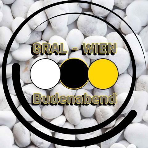 Logo Budenabend auf weißen Kieseln 3 Farbkreise weiß schwarz gold und Text Gral Wien BUdenabend